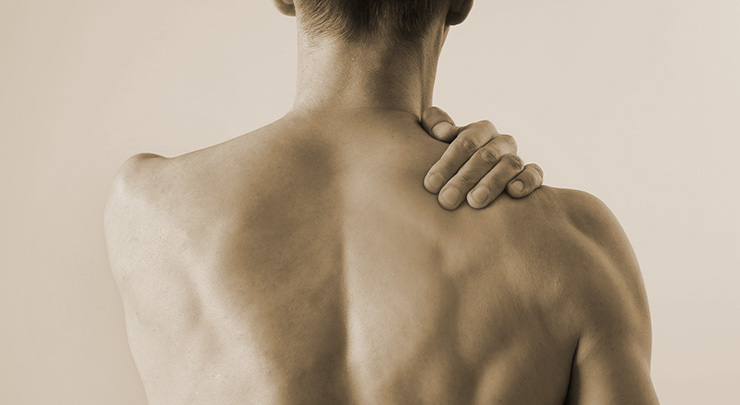 Man suffering from back and neck pain. Chiropractic concept. Sport exercising injury